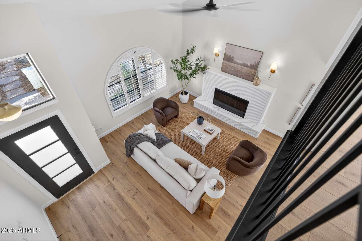 15850 North 15th Way Phoenix, AZ 85022 - Photo 34 of 43 a living room with furniture and a flat screen tv
