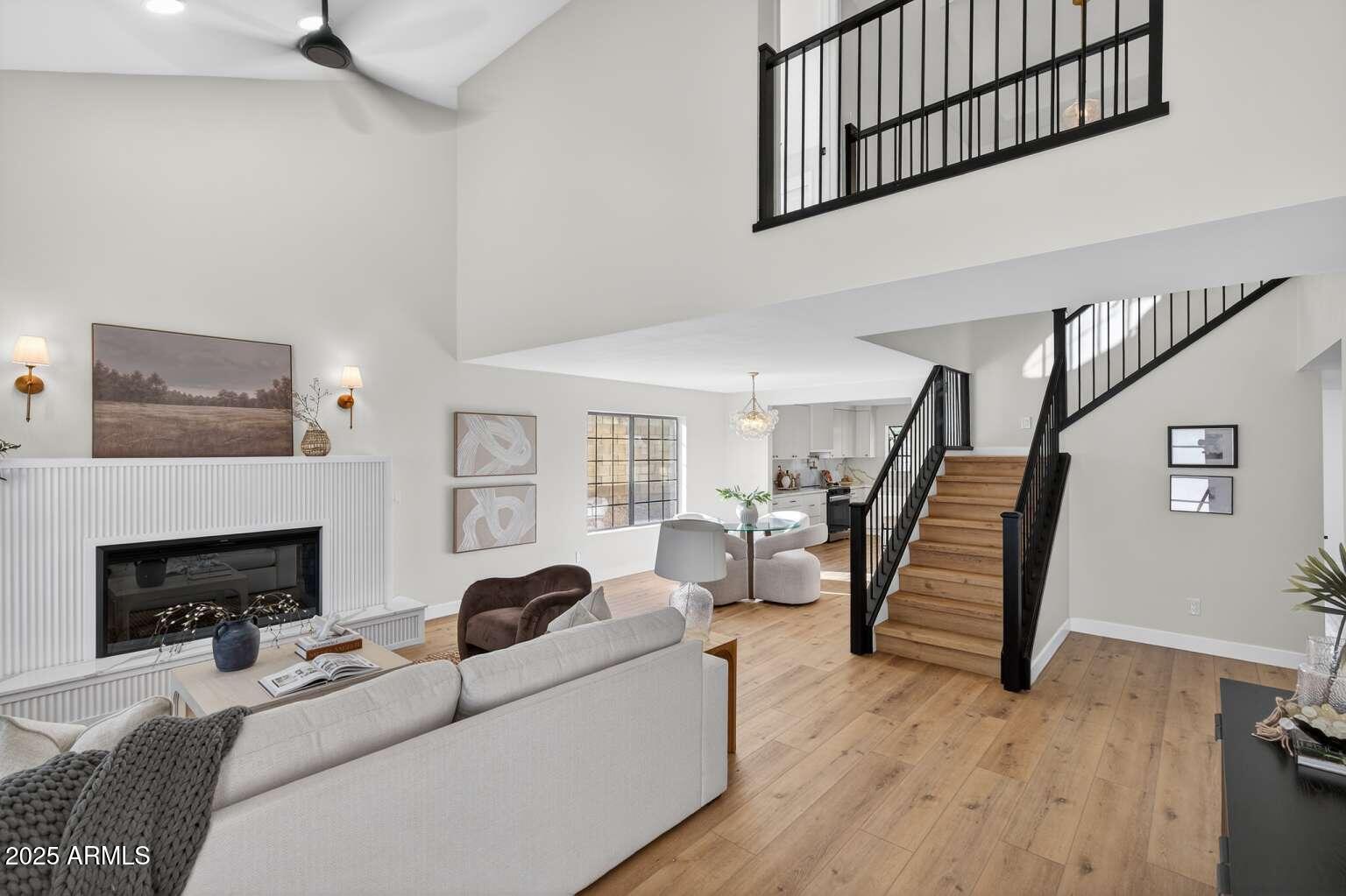 15850 North 15th Way Phoenix, AZ 85022 - Photo 6 of 43 a living room with furniture and a fireplace
