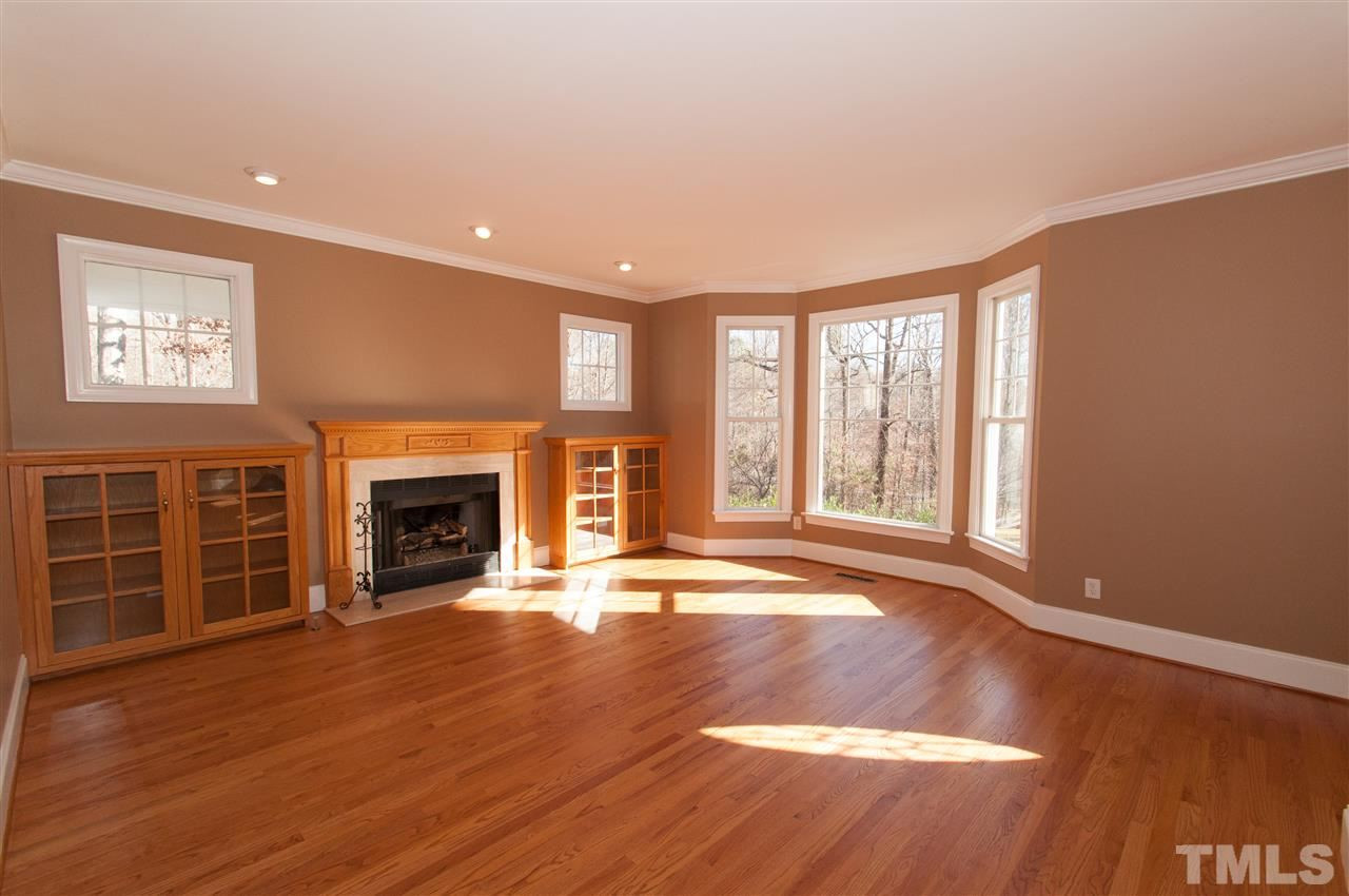 Lovely hardwoods, gas log fireplace, built-ins and bat window Living Room