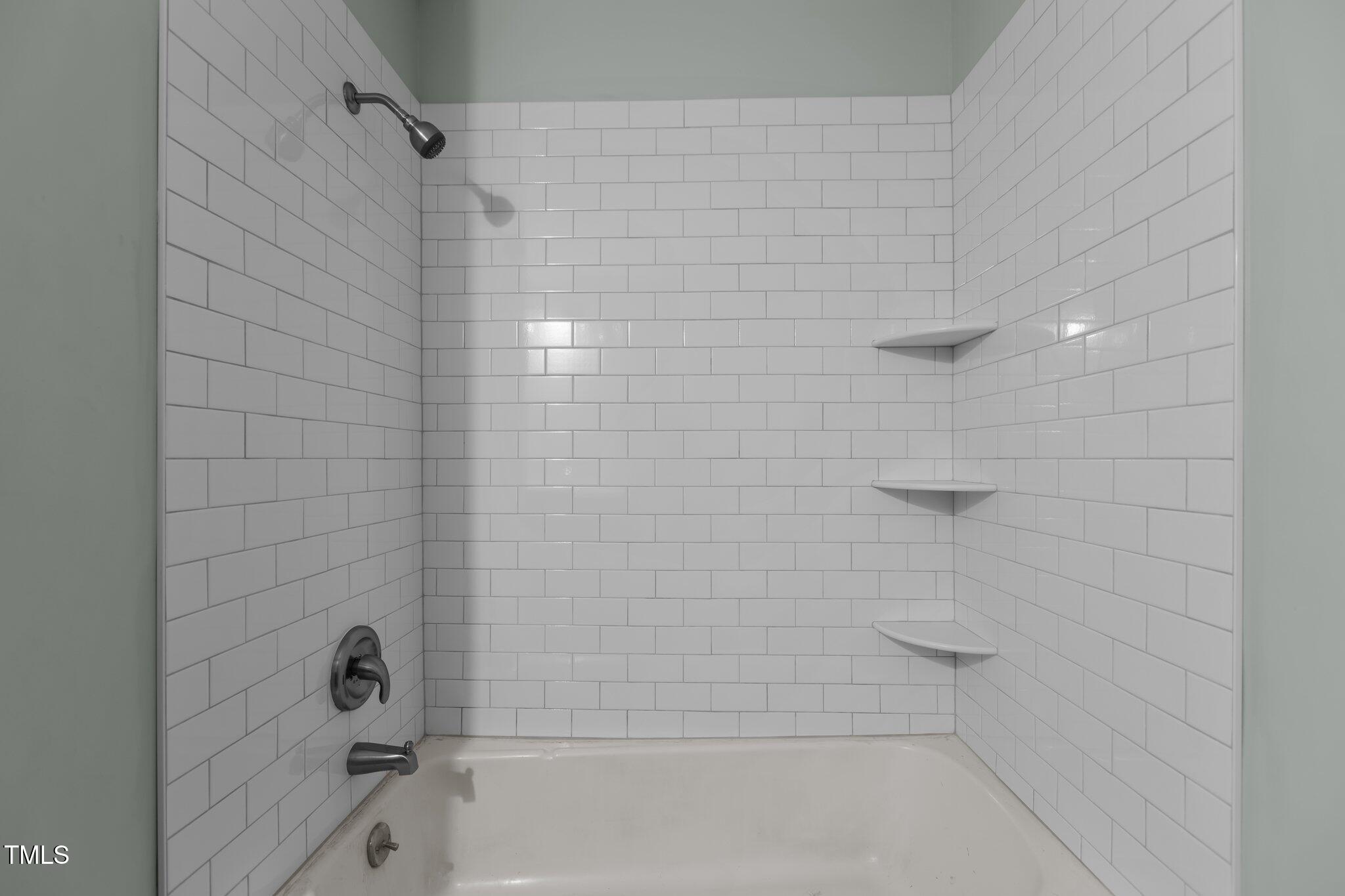 1304 Seaton Road, Unit 24 Durham, NC 27713 - Photo 10 of 38 a bathroom with a shower