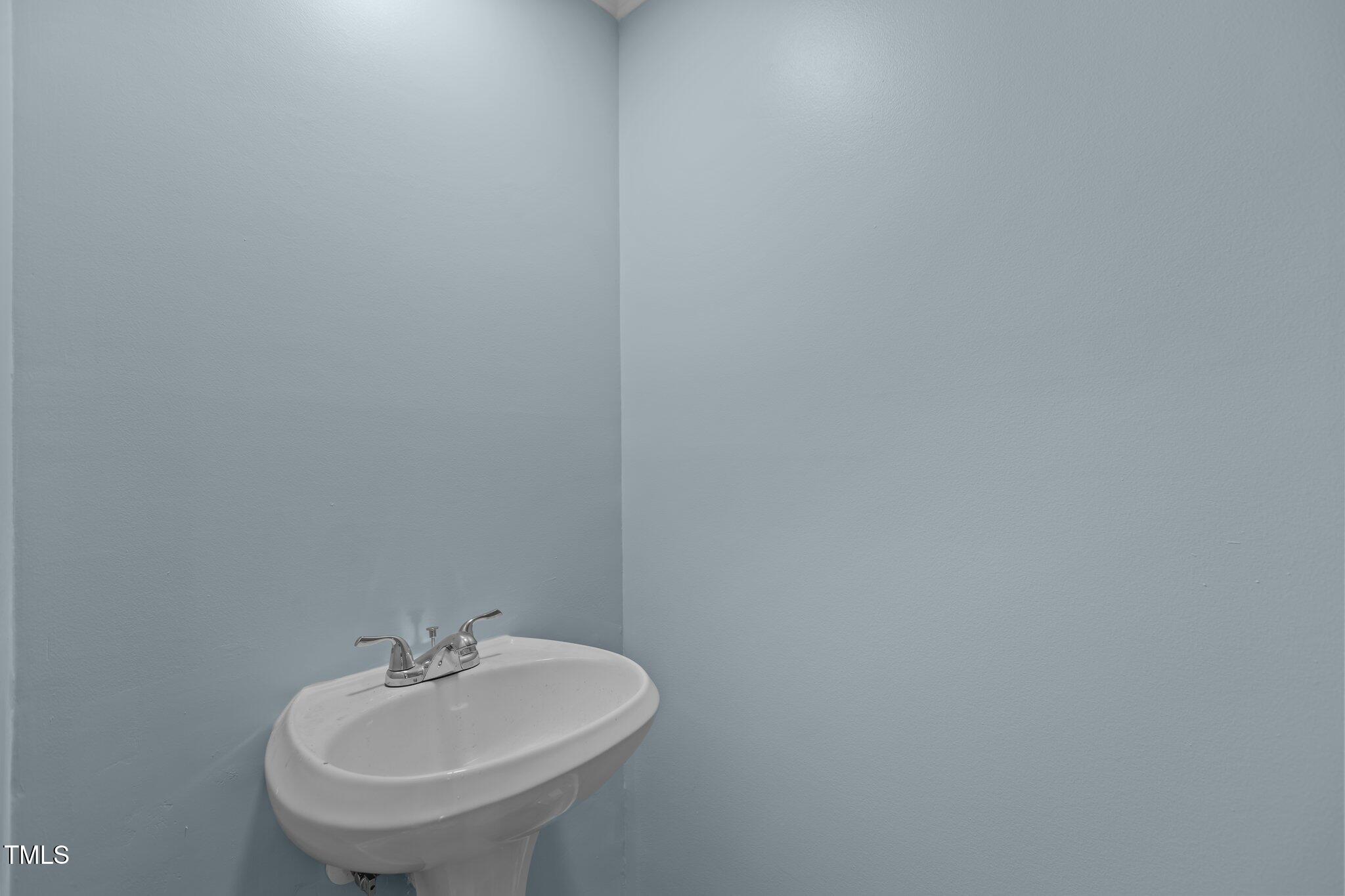 1304 Seaton Road, Unit 24 Durham, NC 27713 - Photo 11 of 38 a bathroom with a sink and a mirror