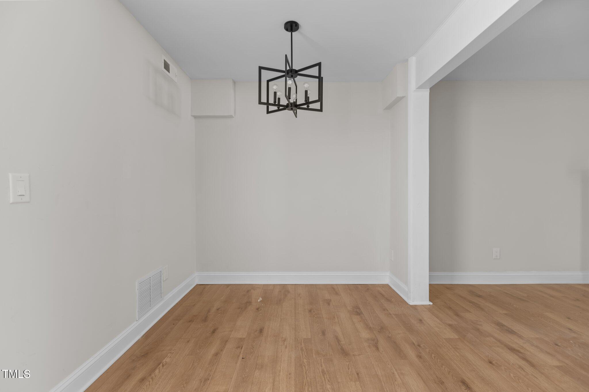 1304 Seaton Road, Unit 24 Durham, NC 27713 - Photo 16 of 38 a view of a room with wooden floor