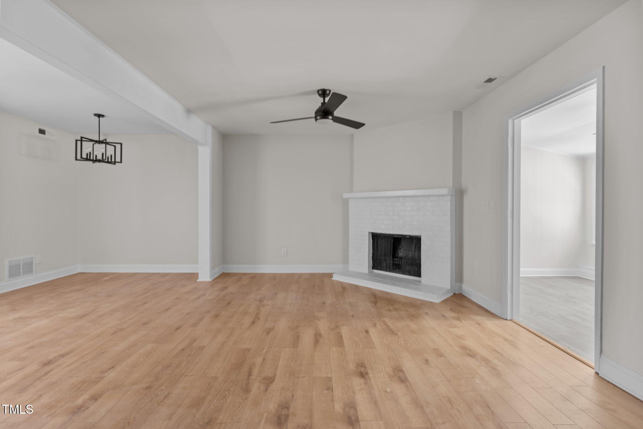 1304 Seaton Road, Unit 24 Durham, NC 27713 - Photo 19 of 38 a view of empty room with a fireplace