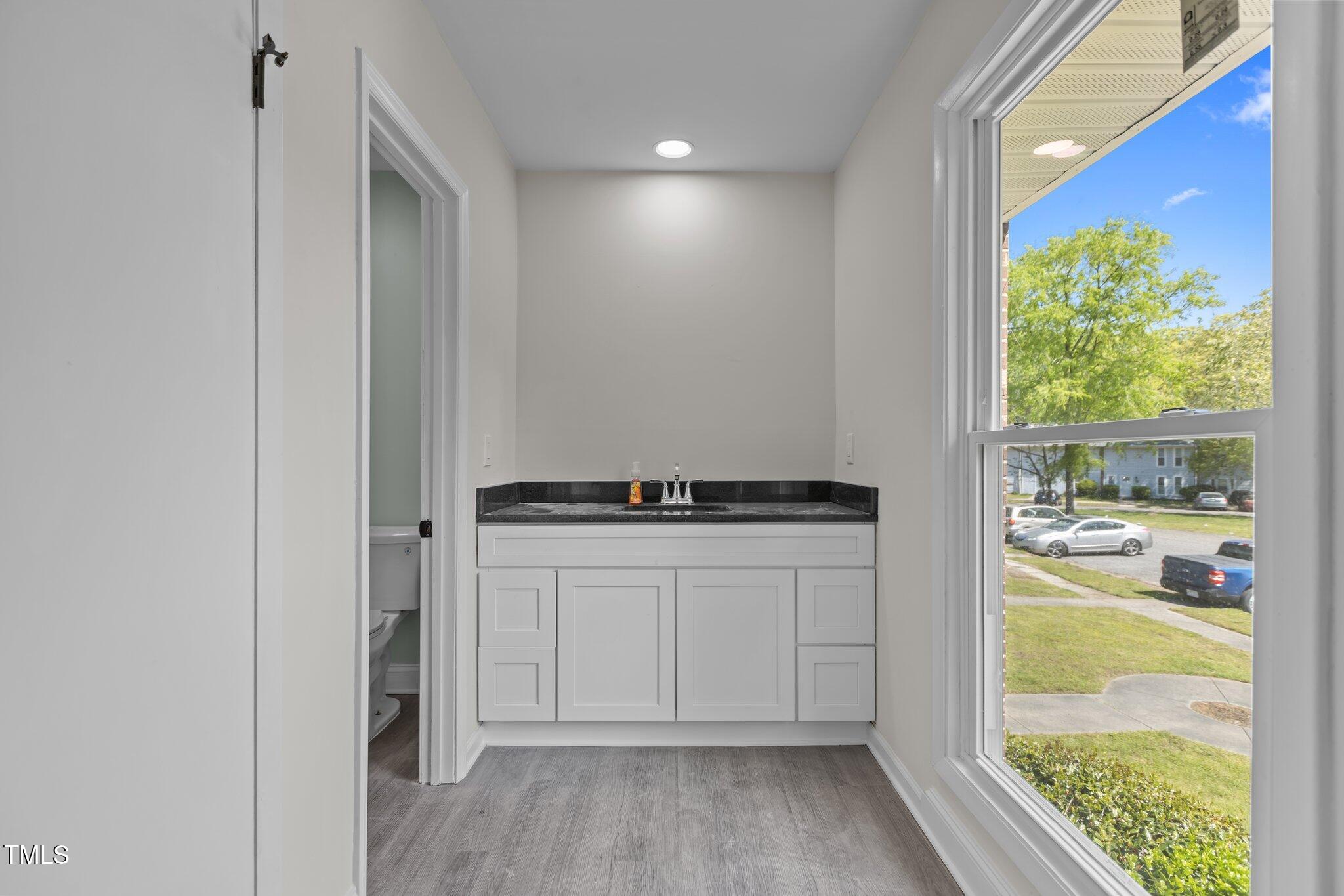 1304 Seaton Road, Unit 24 Durham, NC 27713 - Photo 26 of 38 a view of kitchen with wooden floor