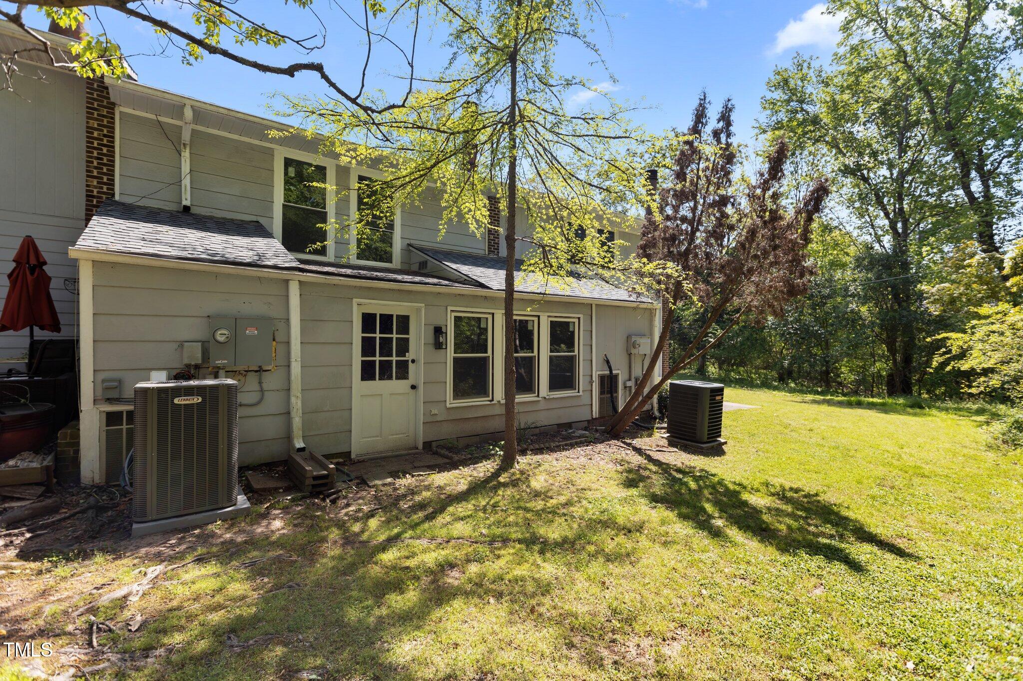 1304 Seaton Road, Unit 24 Durham, NC 27713 - Photo 35 of 38 a view of a house with a yard
