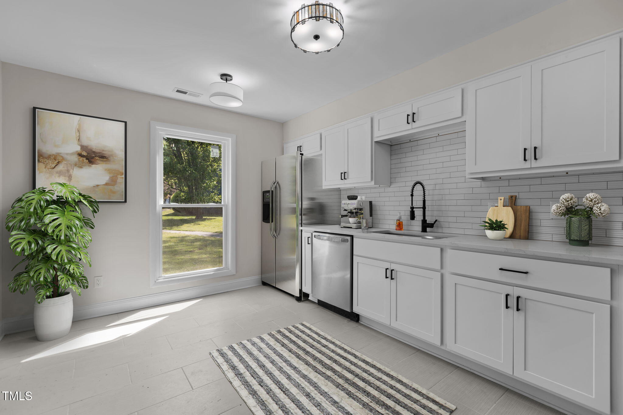 1304 Seaton Road, Unit 24 Durham, NC 27713 - Photo 3 of 38 a kitchen with a white cabinets and window
