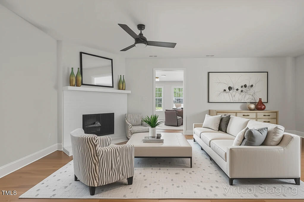 1304 Seaton Road, Unit 24 Durham, NC 27713 - Photo 4 of 38 a living room with furniture and a fireplace