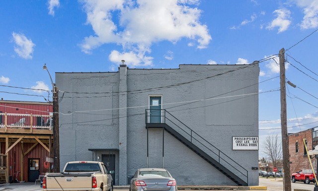 201 North State Street Geneseo, IL 61254 - Photo 2 of 49 a car parked on the street next to a building