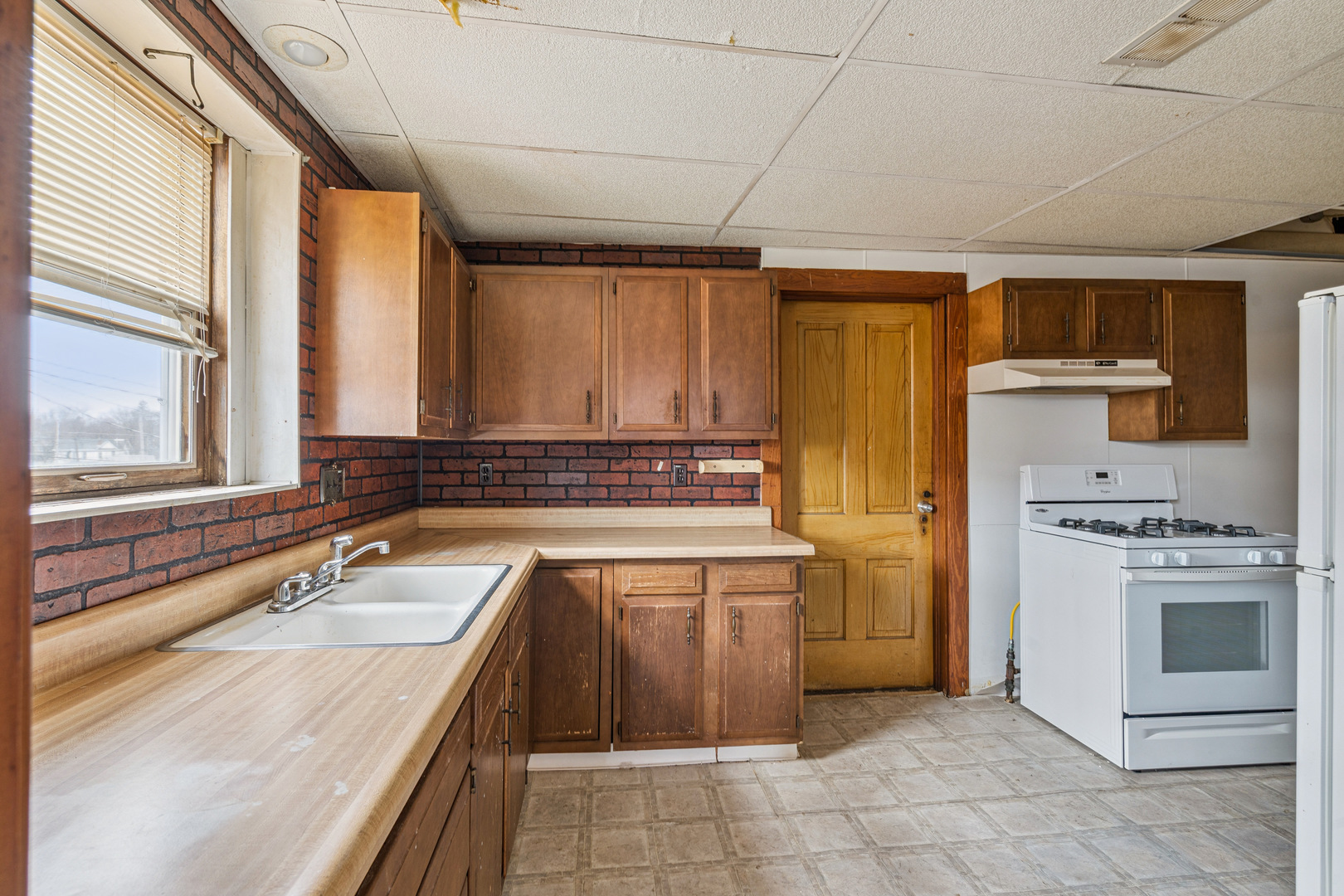 201 North State Street Geneseo, IL 61254 - Photo 29 of 49 a kitchen with a sink stove and refrigerator