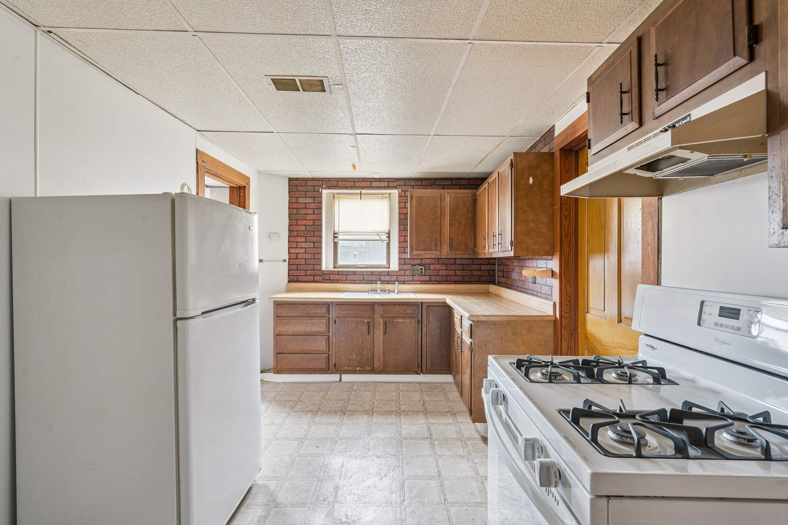 201 North State Street Geneseo, IL 61254 - Photo 30 of 49 a kitchen with stainless steel appliances granite countertop a refrigerator and a stove