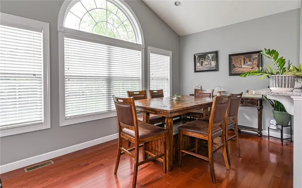 a view of a dining room kitchen and a wooden floor