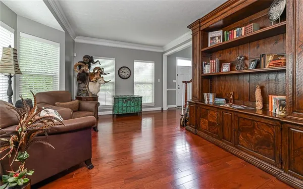 a view of a livingroom with furniture and hardwood