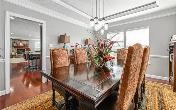 a view of kitchen with furniture and wooden floor