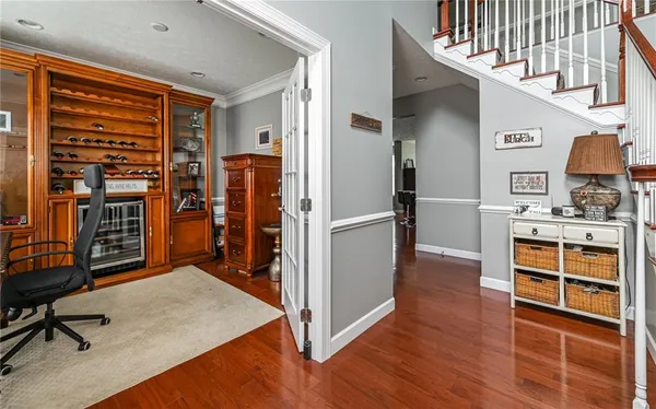 a view of a workspace with furniture and a window