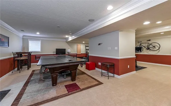 a room with gym equipment and white walls
