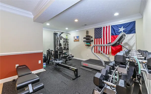 a living room with lots of furniture and kitchen view