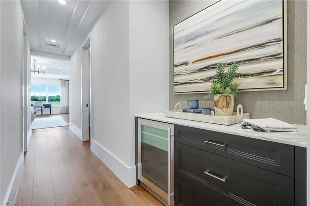 a hallway with a sink and a window