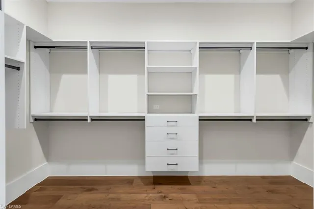 a view of an empty walk in closet