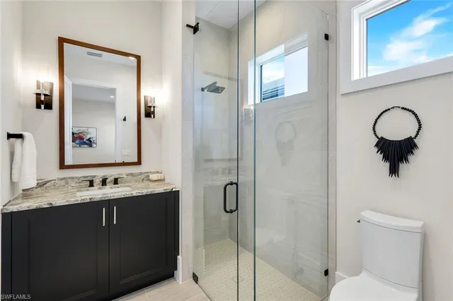 a spacious bedroom with a bed and a couch