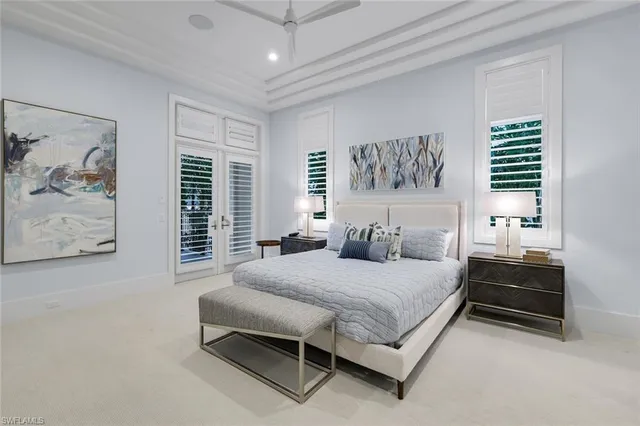 a spacious bathroom with a bathtub sink mirror and shower