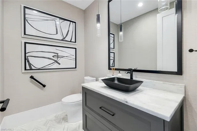 a utility room with sink dryer and washer