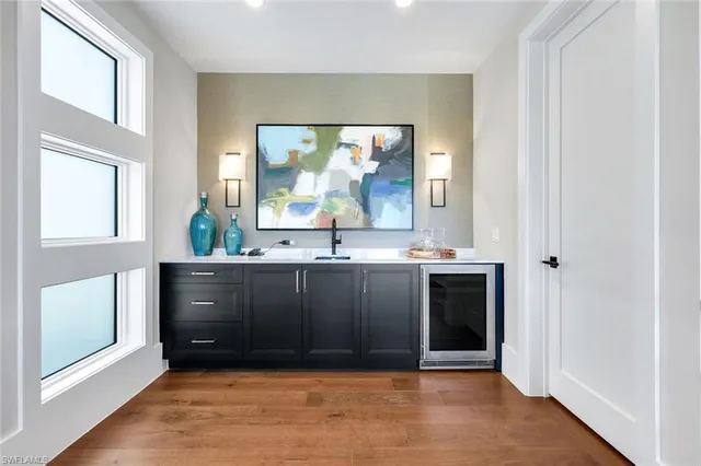 an empty room with a ceiling fan and window