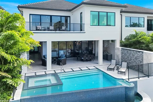a view of a swimming pool with a lounge chairs