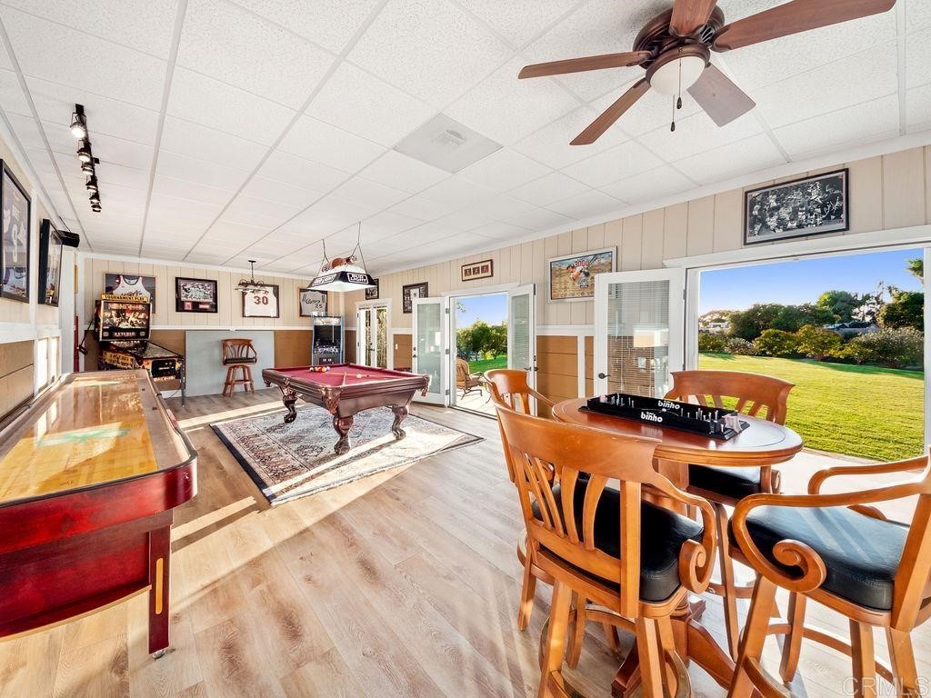 2906 Wishbone Way Encinitas, CA 92024 - Photo 8 of 13 a living room with furniture and a flat screen tv