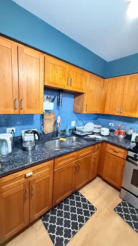 a kitchen that has a sink and a stove