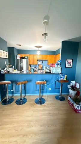 a living room with lots of furniture and air hockey table
