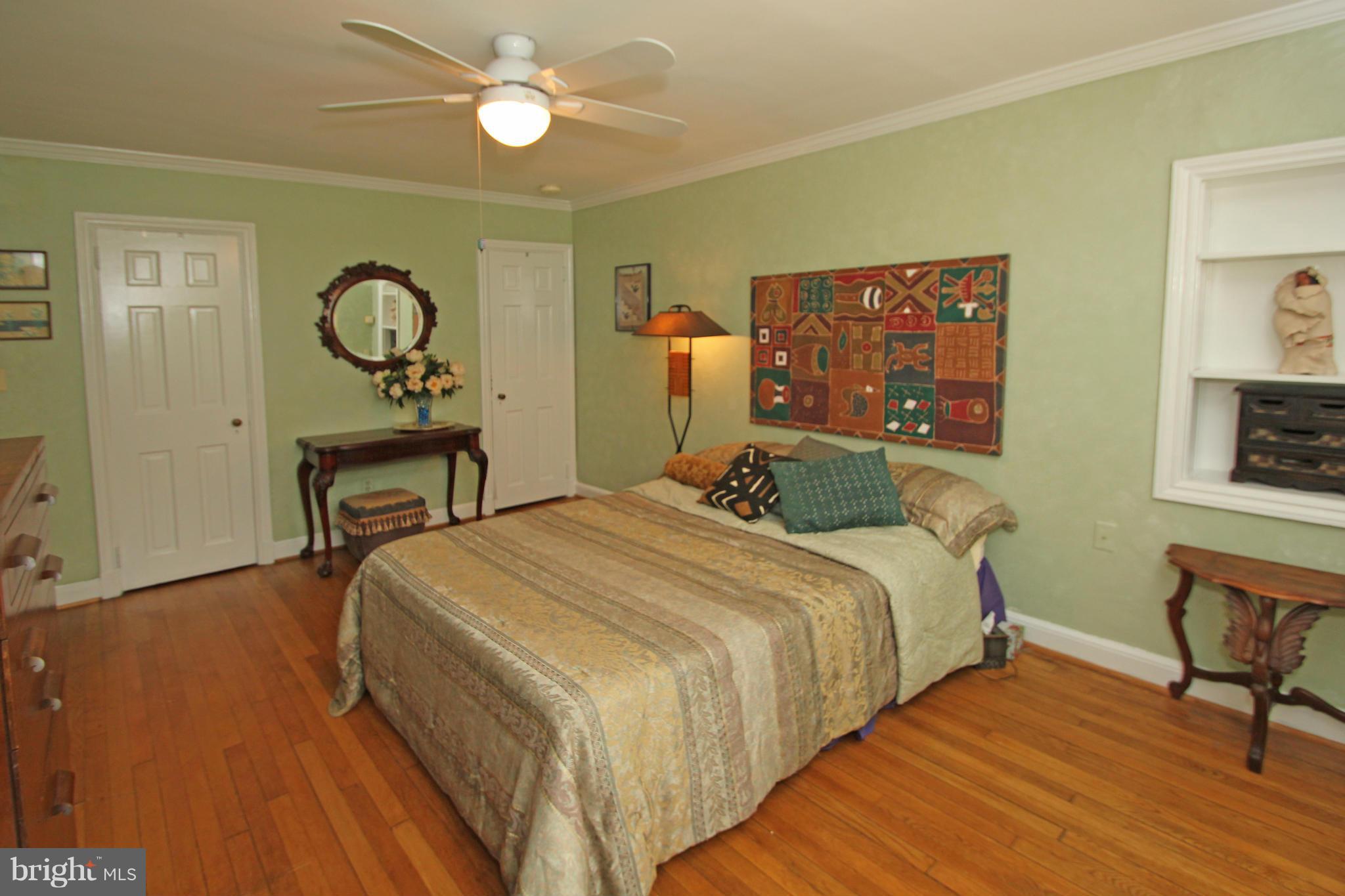 21 Sussex Road Silver Spring, MD 20910 - Photo 12 of 30 a bedroom with bed and a table