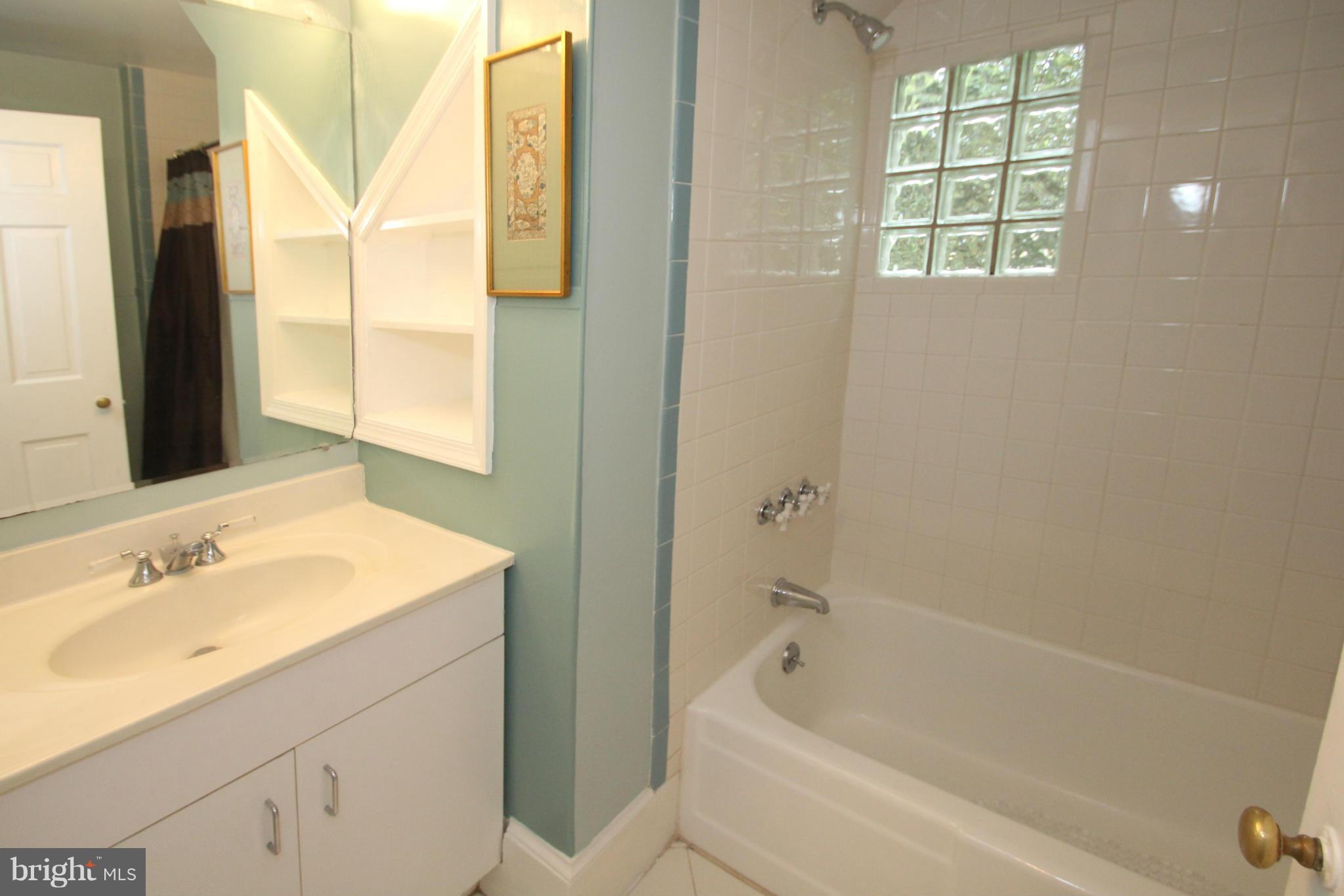 21 Sussex Road Silver Spring, MD 20910 - Photo 15 of 30 a bathroom with a sink and a bathtub