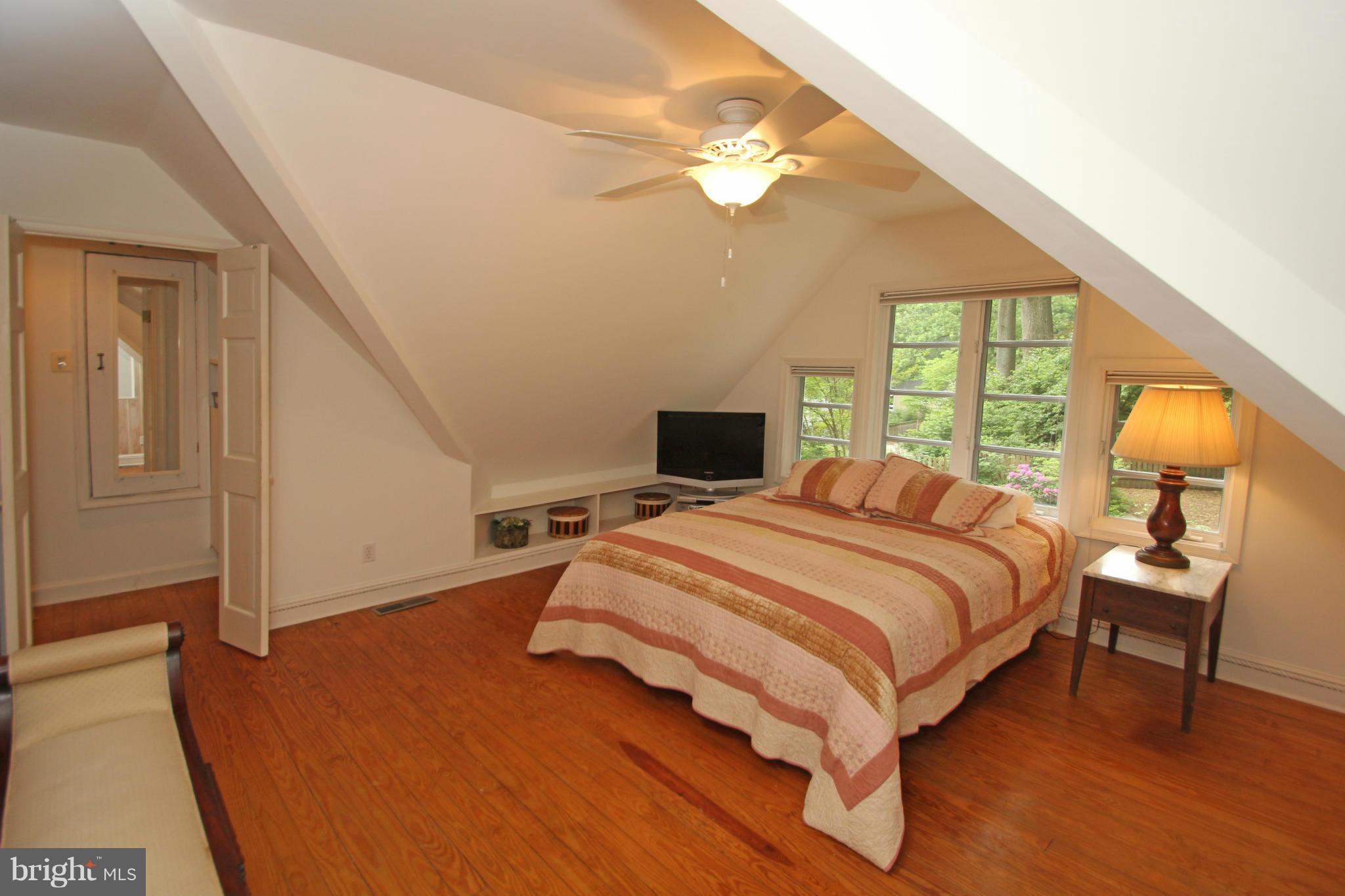21 Sussex Road Silver Spring, MD 20910 - Photo 16 of 30 a bedroom with a bed a window and lamps