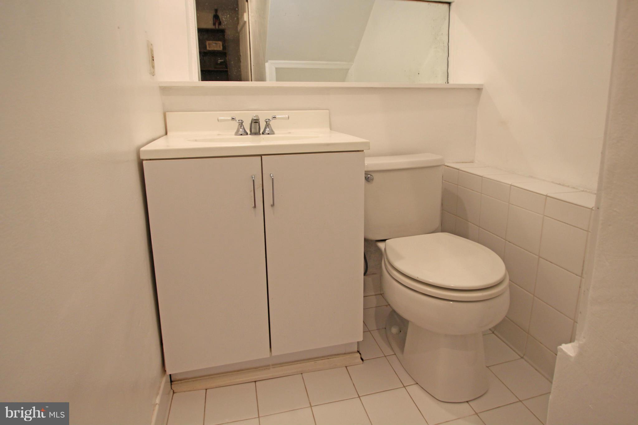 21 Sussex Road Silver Spring, MD 20910 - Photo 22 of 30 a bathroom with a sink toilet and vanity