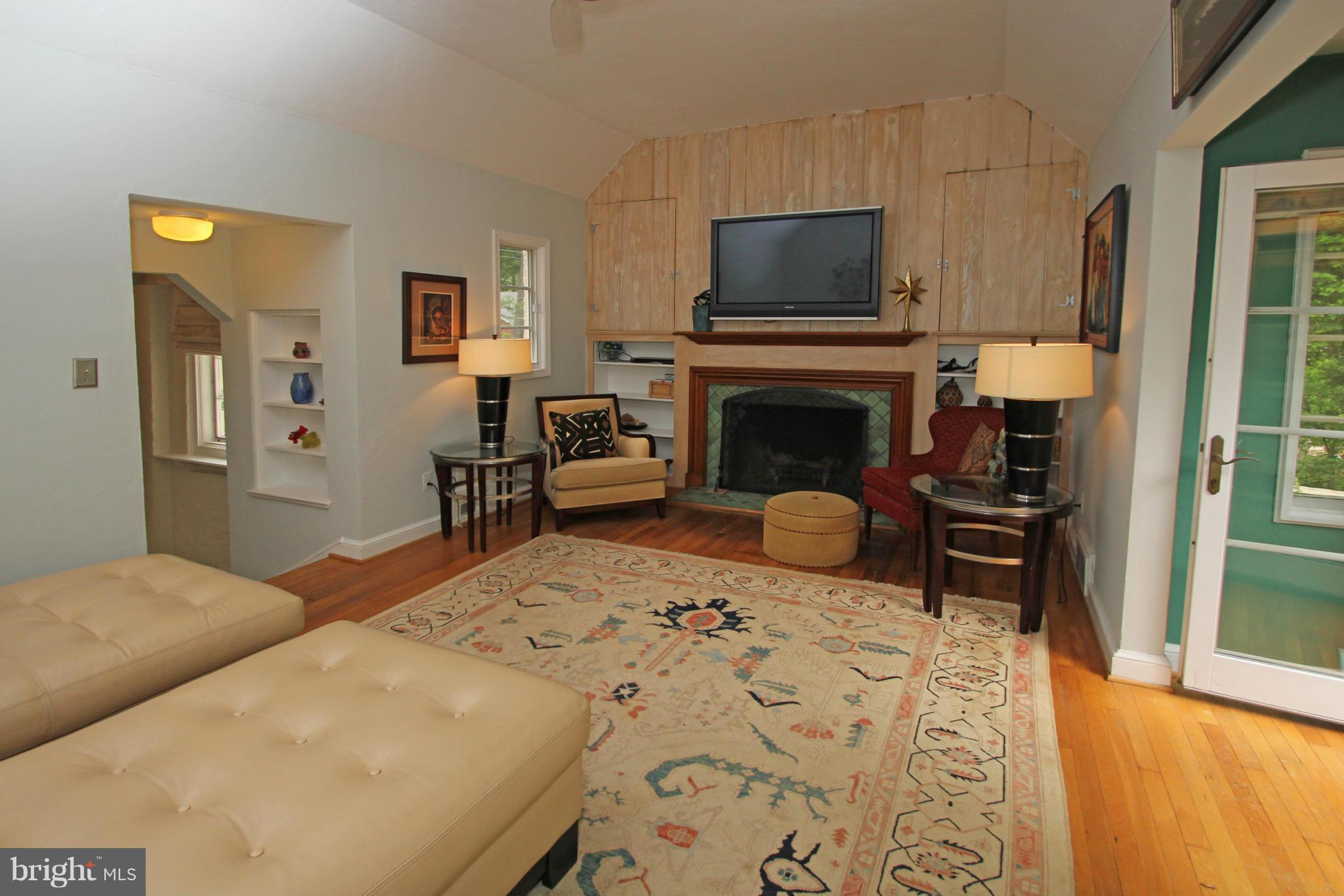 21 Sussex Road Silver Spring, MD 20910 - Photo 5 of 30 a bedroom with a bed and a fireplace