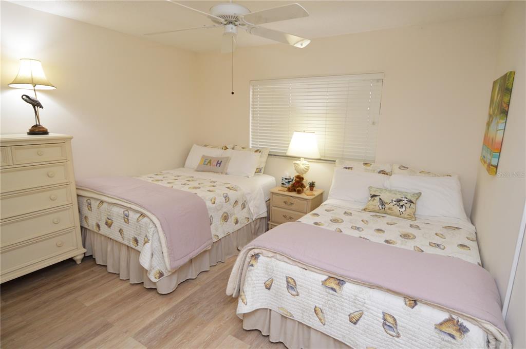 900 Gulf Boulevard, Unit 907 Indian Rocks Beach, FL 33785 - Photo 49 of 88 a bedroom with two beds and a window