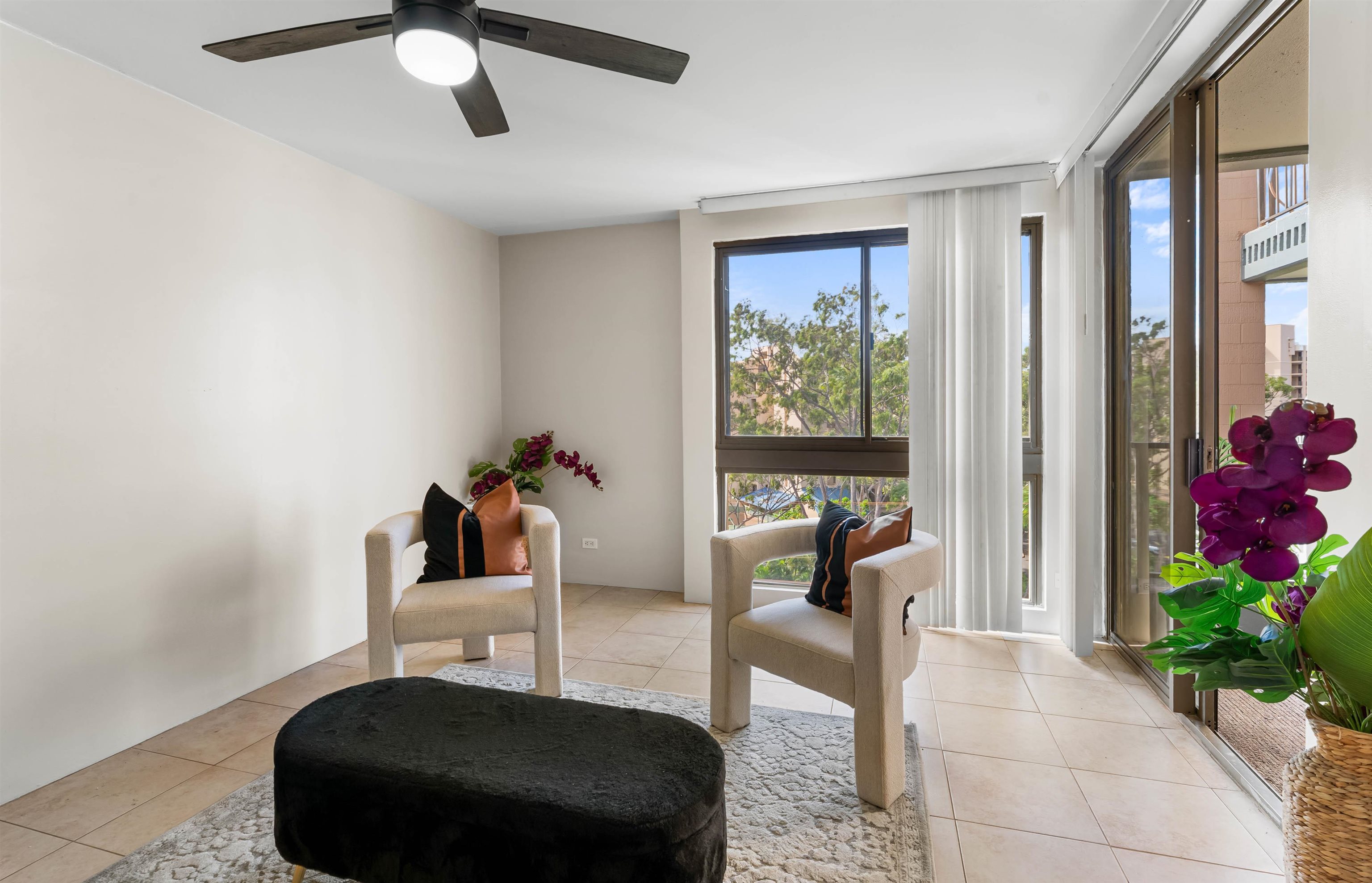 a bedroom with furniture and a potted plant