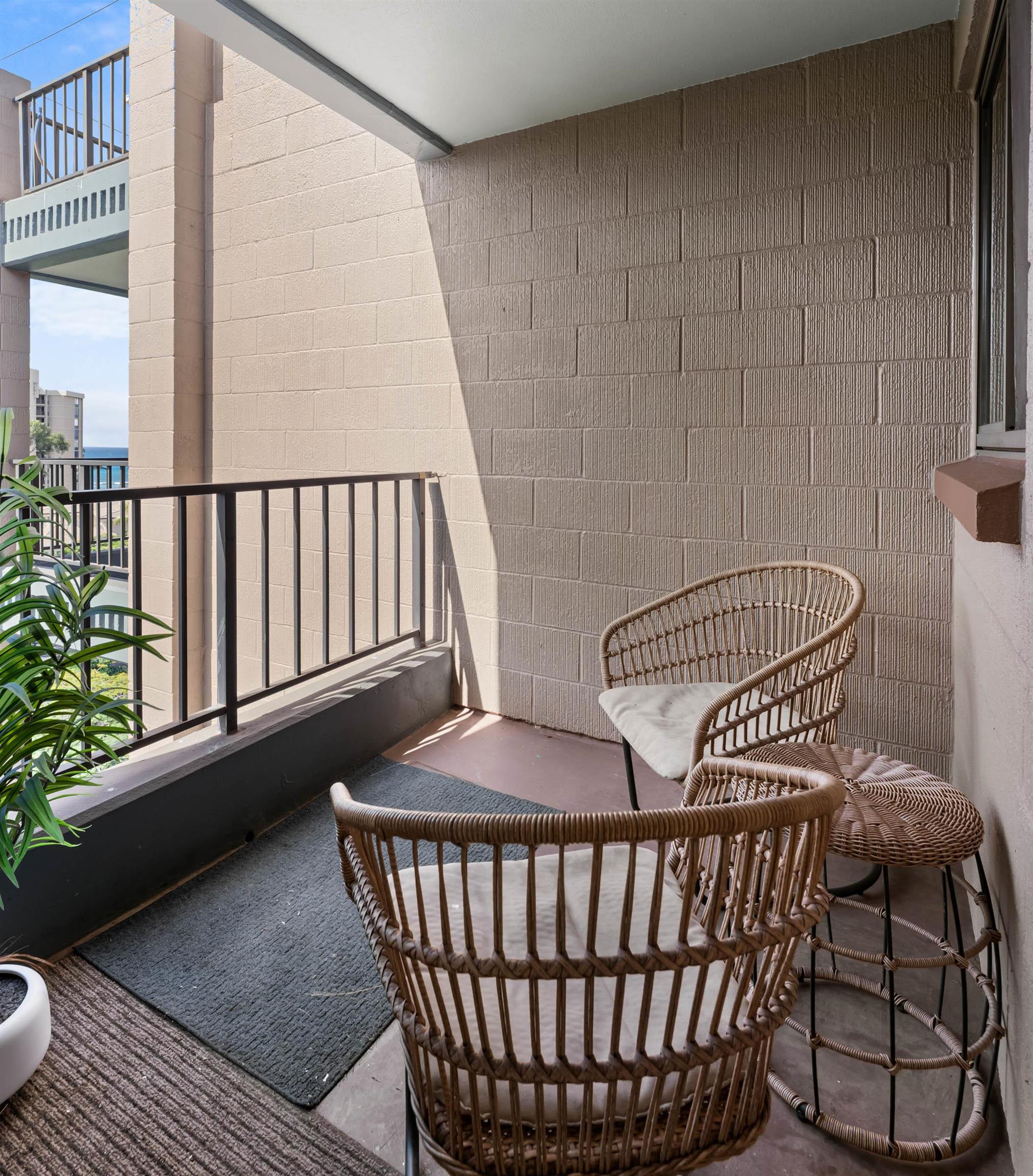 4310 Lower Honoapiilani Road, Unit 609 Lahaina, HI 96761 - Photo 14 of 29 a view of a chair in wooden floor