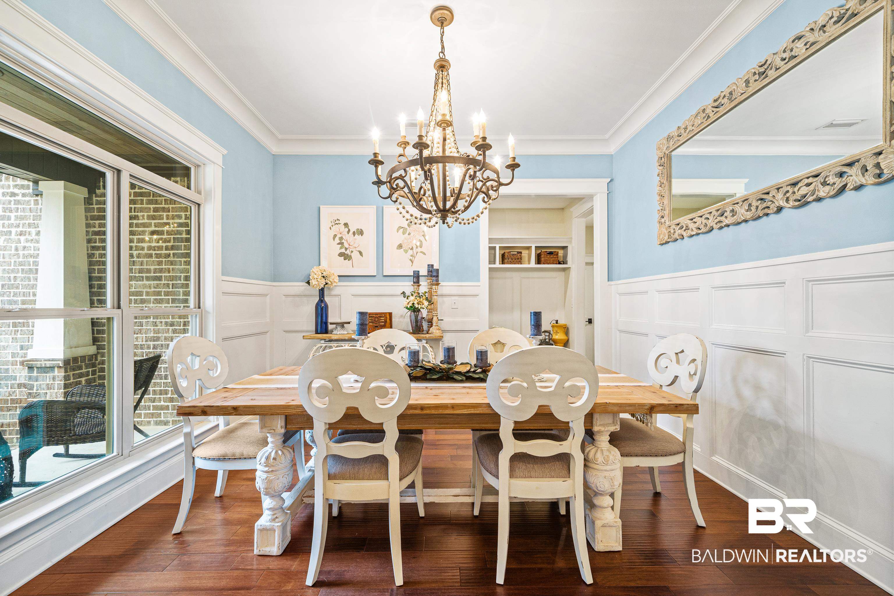 36784 Legacy Way Bay Minette, AL 36507 - Photo 5 of 57 Dining area featuring an inviting chandelier, ornamental molding, wood-style flooring
