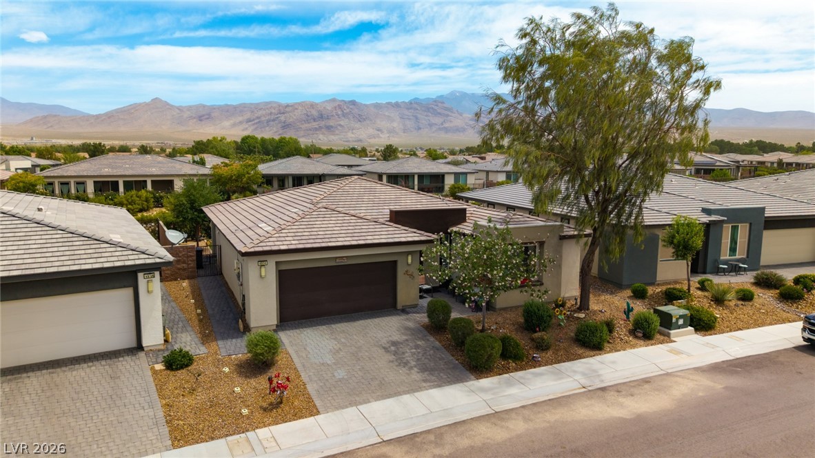 4914 East Beacon Ridge Drive Pahrump, NV 89061 - Photo 30 of 34 A desert oasis, this home features a charming desert landscape and inviting curb appeal.
