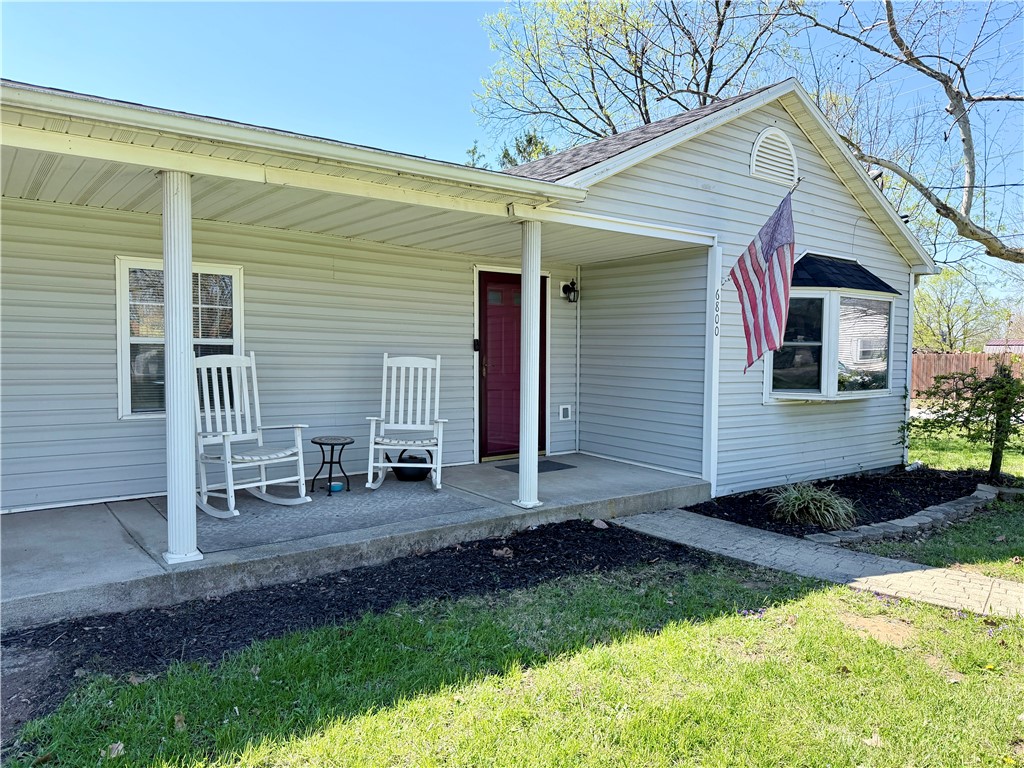 6800 Farmington Road Miamisburg, OH 45342 - Photo 3 of 32 This charming residence features a welcoming covered front porch, perfect for outdoor relaxation.