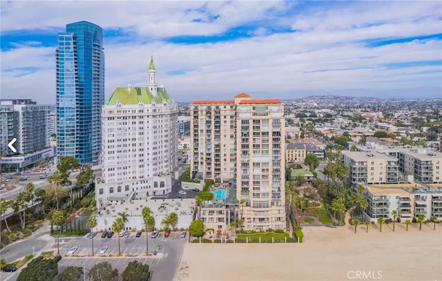 a large living room with lots of furniture and a large window