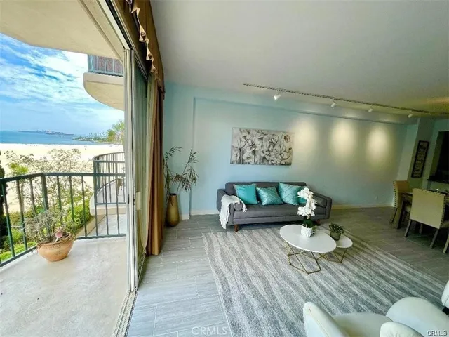 a kitchen with granite countertop a refrigerator a sink and a stove