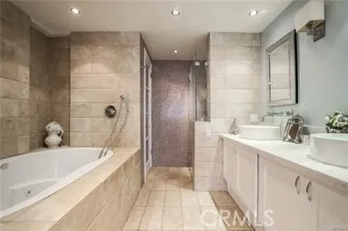 a bathroom with a shower and a sink