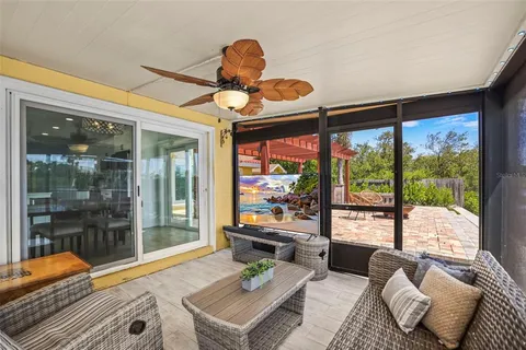 a roof deck with table and chairs a barbeque with wooden floor and lake view