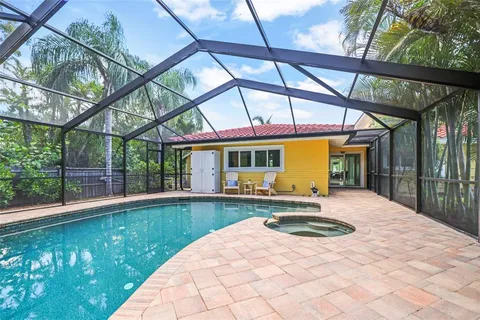 a view of a roof deck with chair and table