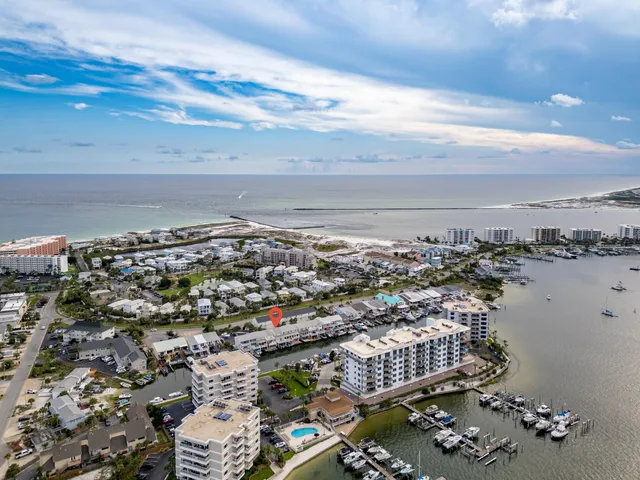 a dining room with furniture and view of kitchen