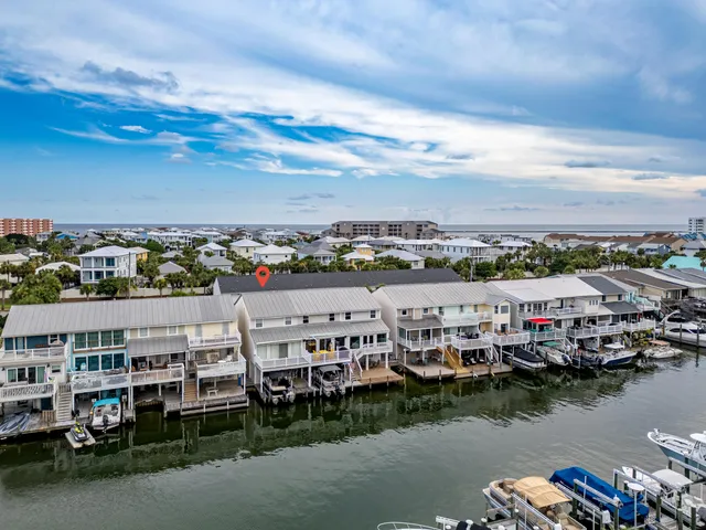 a kitchen with cabinets appliances a sink and a window