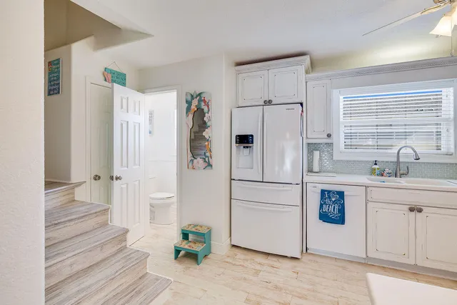 a bathroom with a sink toilet and a mirror