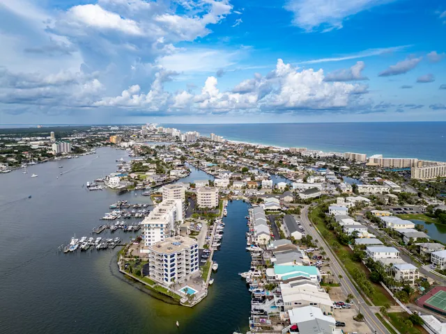 a view of a lake with tall buildings in the background